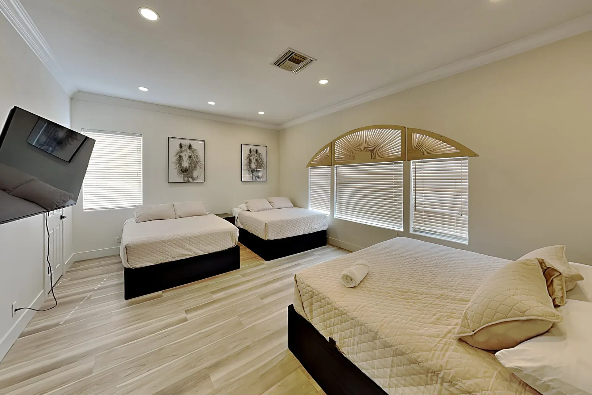 Bedroom 3 — King + two queens · Jack-and-Jill bath