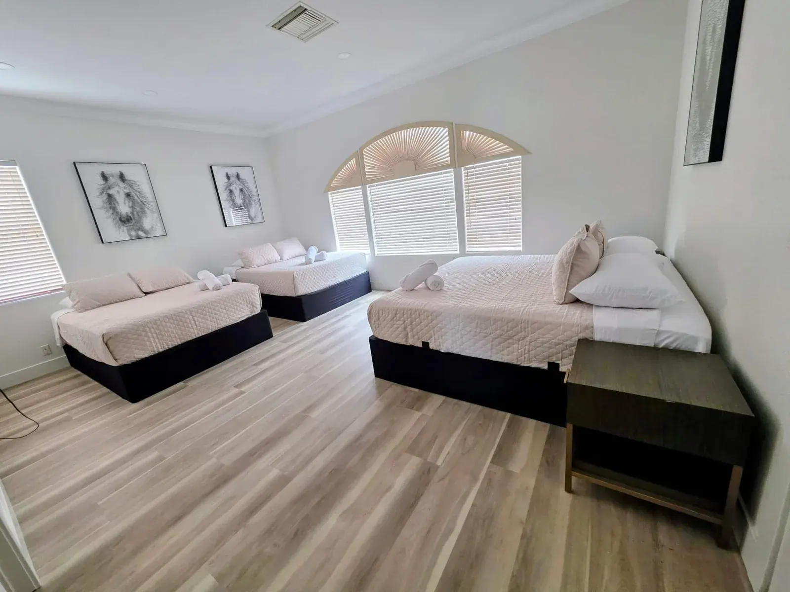 Bedroom 4 — king bed plus two queens