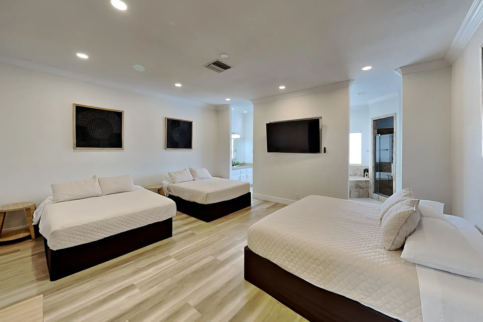 Bedroom 5 — King + two queens · private bath