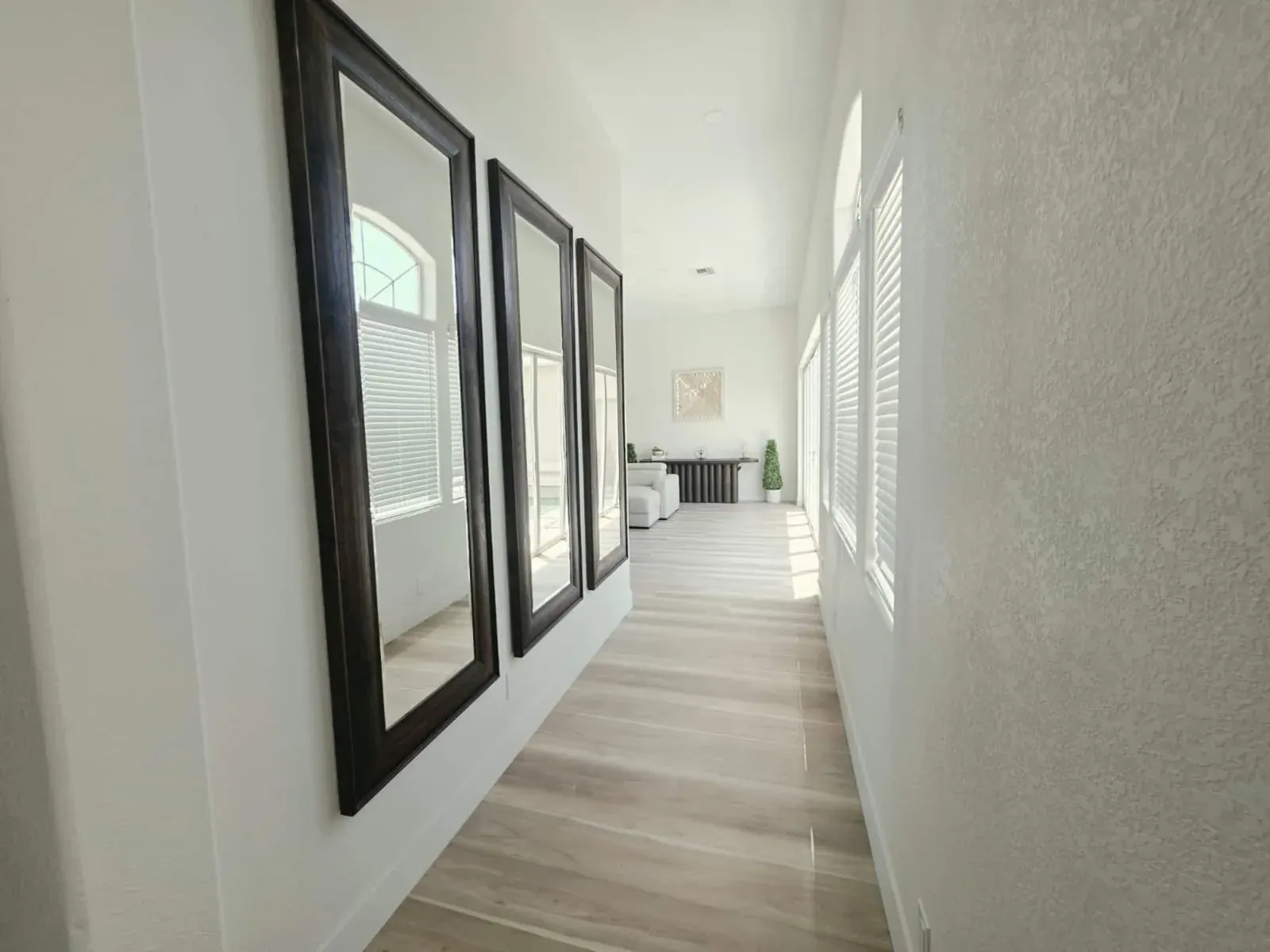Mirrored hallway leading to the living room