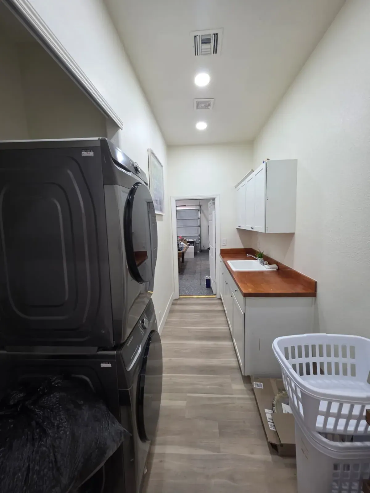 Laundry room with a full-size washer and dryer and a utility sink
