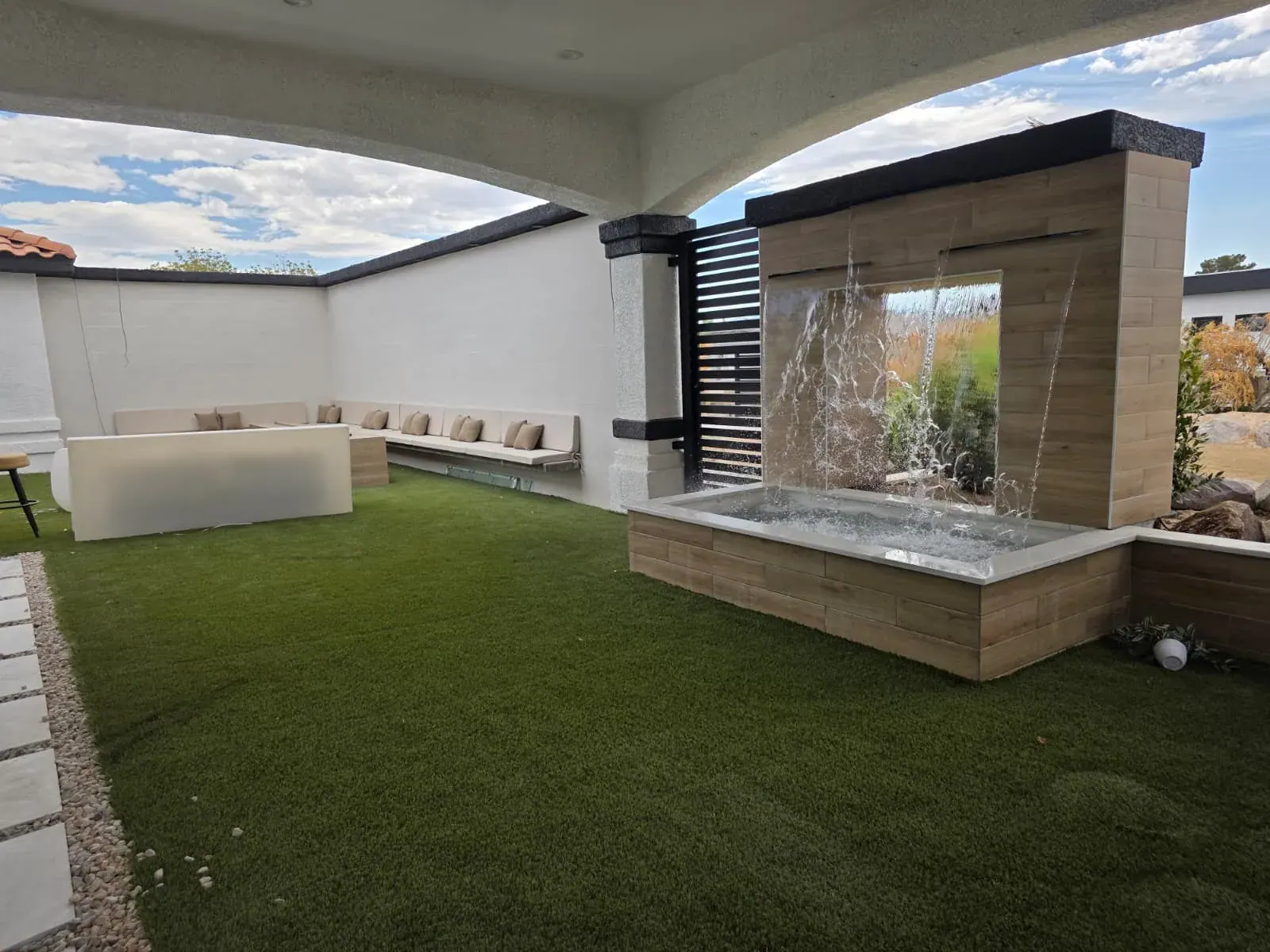 The waterfall plunge feature from the covered lounge, mid-flow